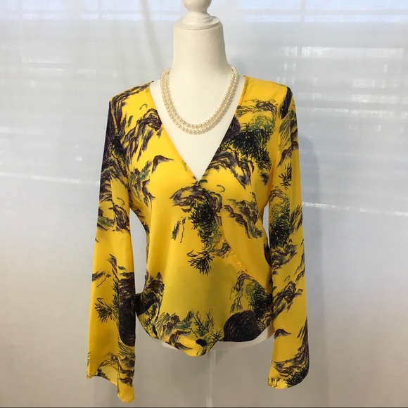Guess Tops - GUESS blouse, with a wrap over front. Size M